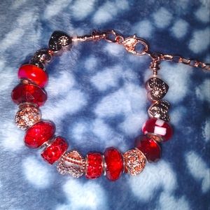 Rose gold snake chain charm bracelet with assorted red European beads